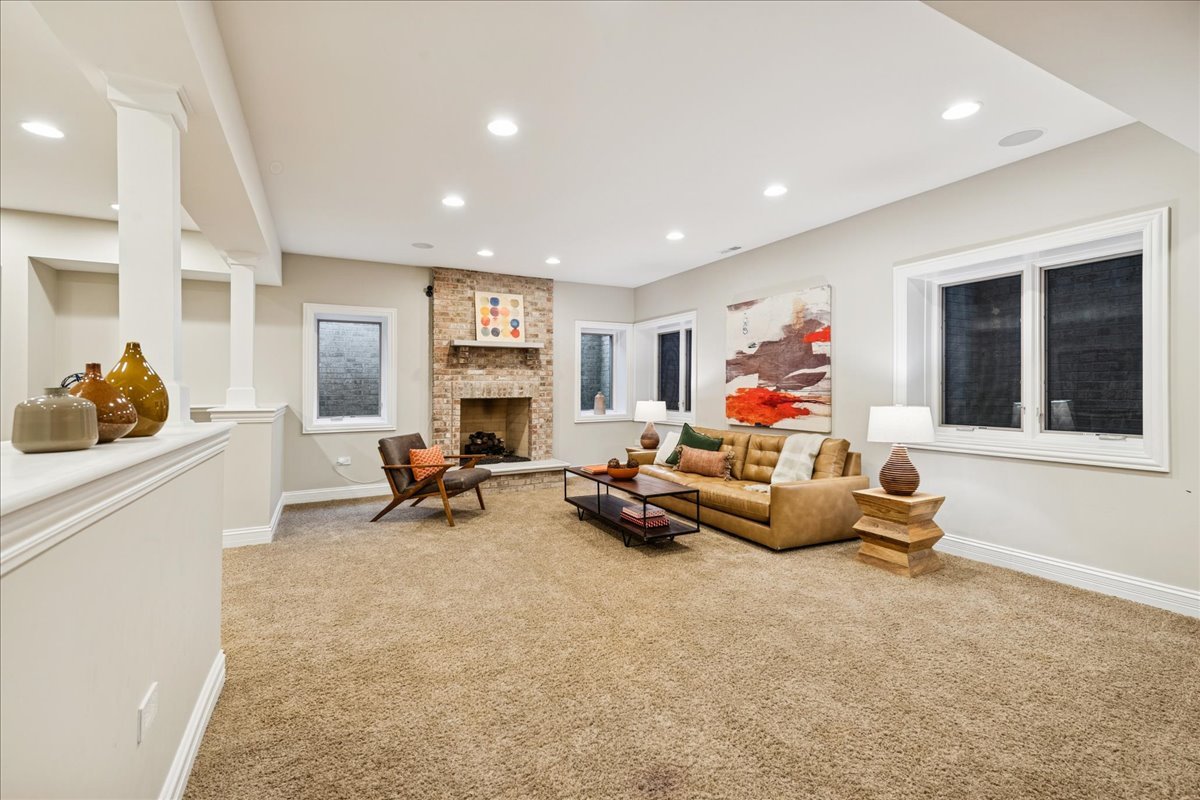 343 Washington Avenue Glencoe, IL 60022 - Photo 30 of 35 a living room with furniture gym equipment and a fireplace