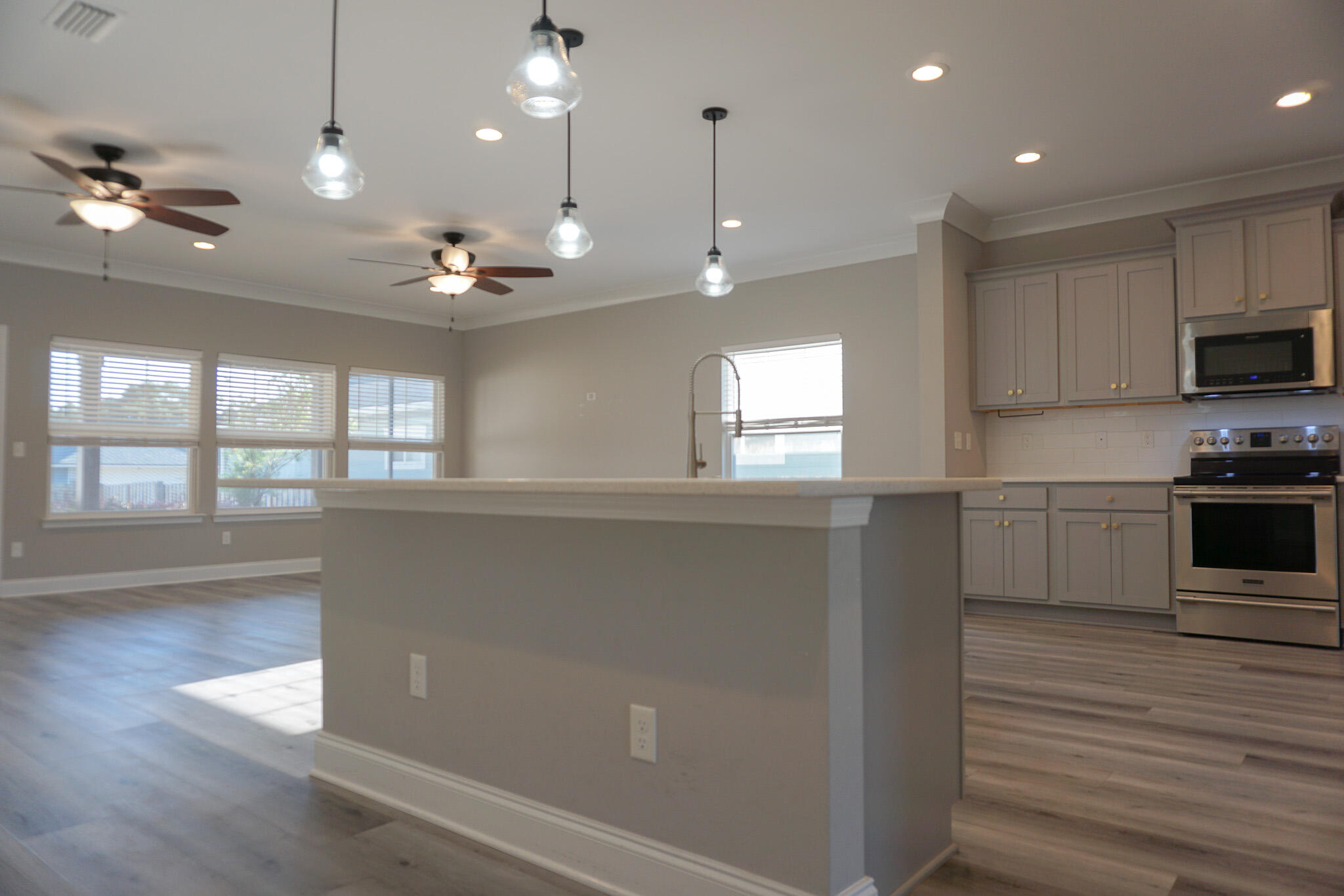 48 9th Avenue Shalimar, FL 32579 - Photo 11 of 60 a view of kitchen with window and wooden floor