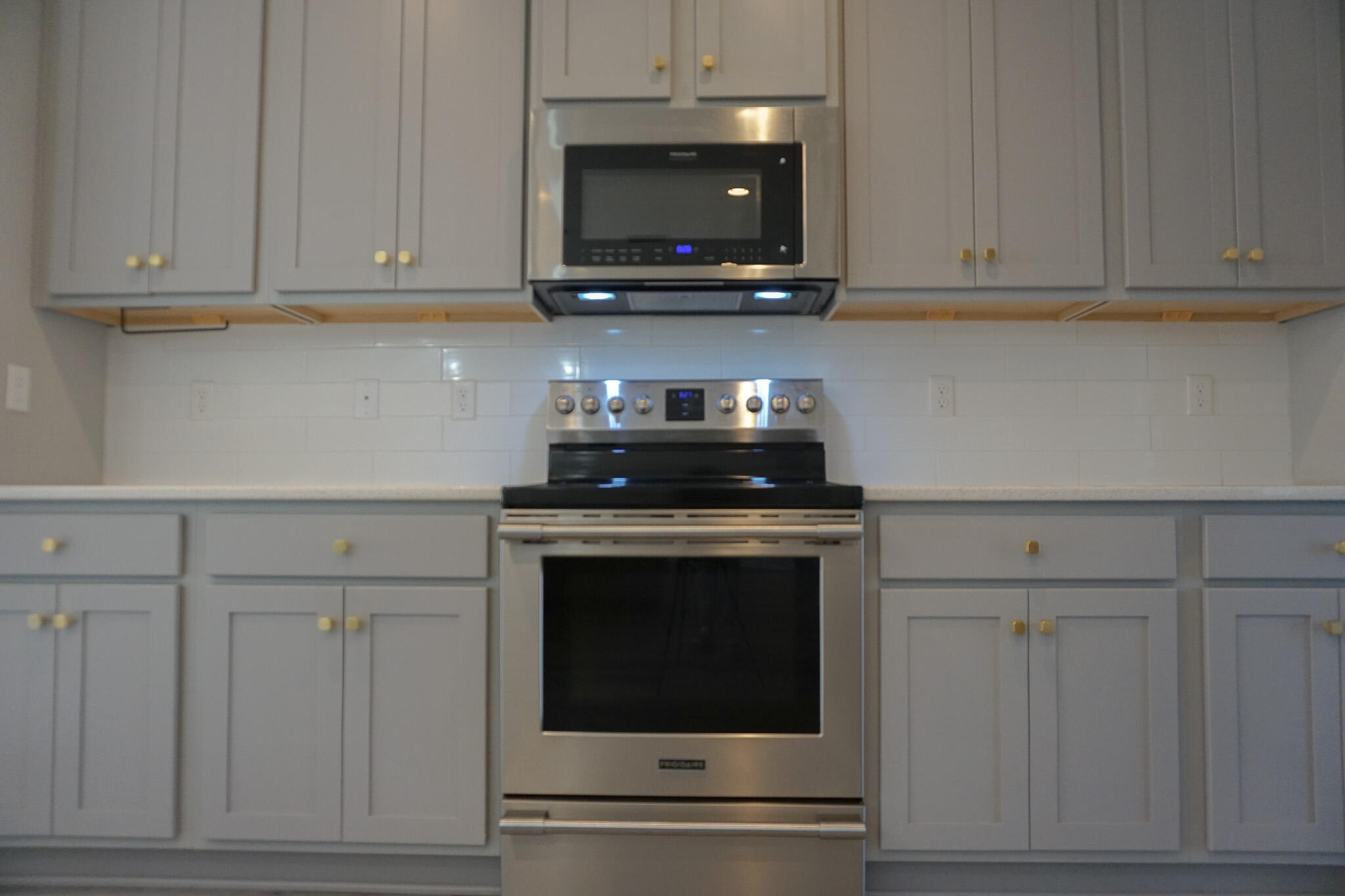 48 9th Avenue Shalimar, FL 32579 - Photo 15 of 60 a kitchen with granite countertop white cabinets stainless steel appliances and sink