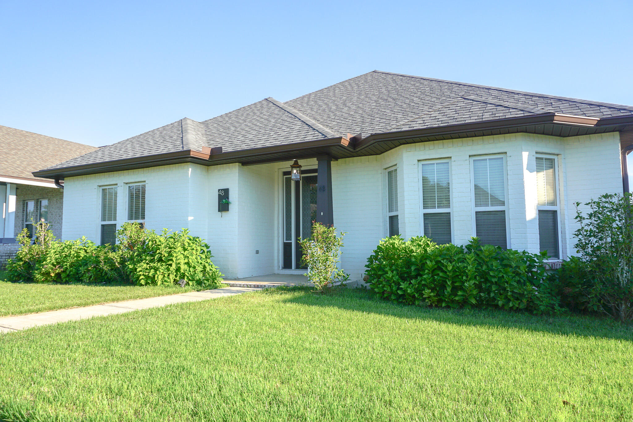 48 9th Avenue Shalimar, FL 32579 - Photo 2 of 60 a view of a house with garden and yard