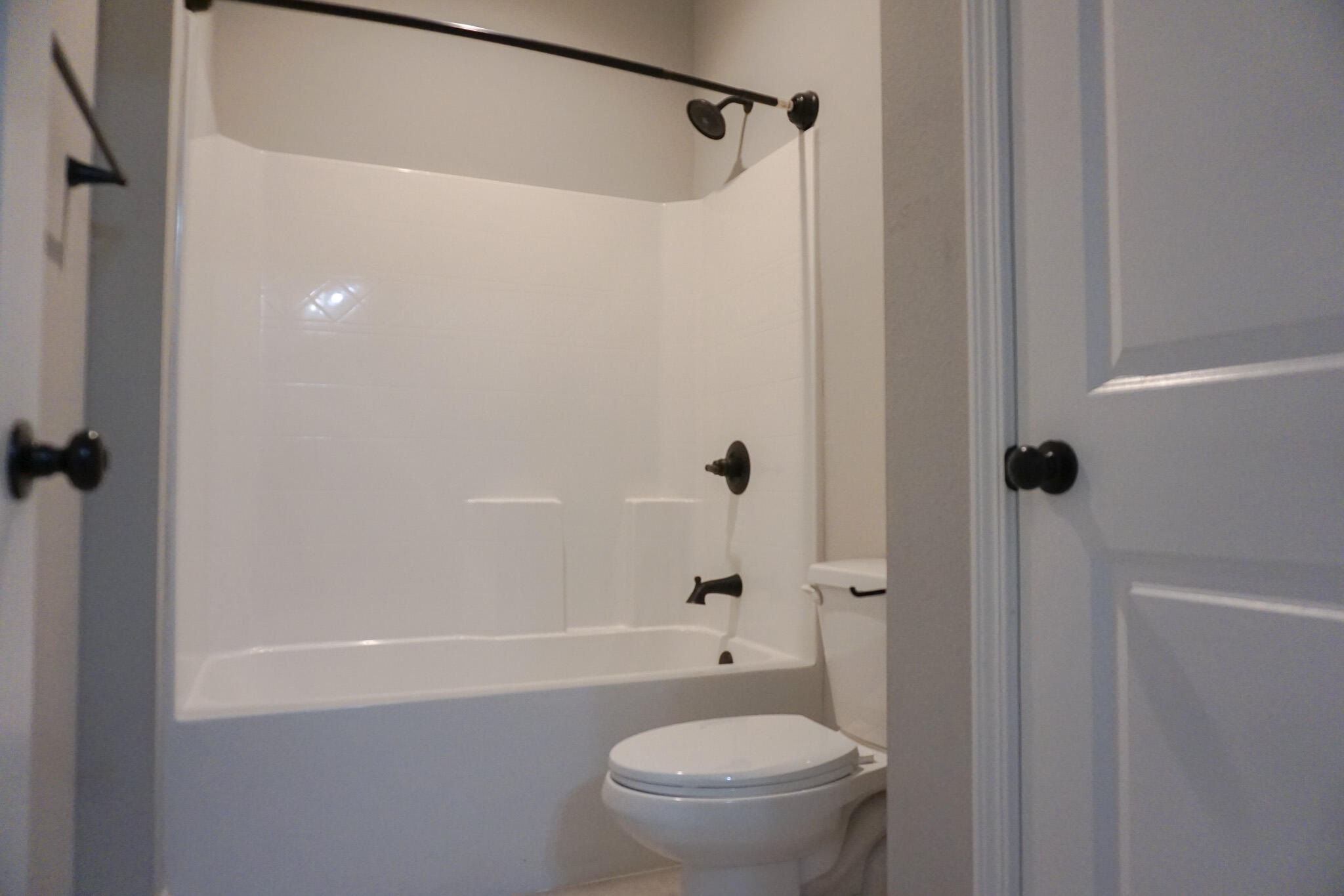 48 9th Avenue Shalimar, FL 32579 - Photo 21 of 60 a bathroom with a granite countertop toilet and a shower