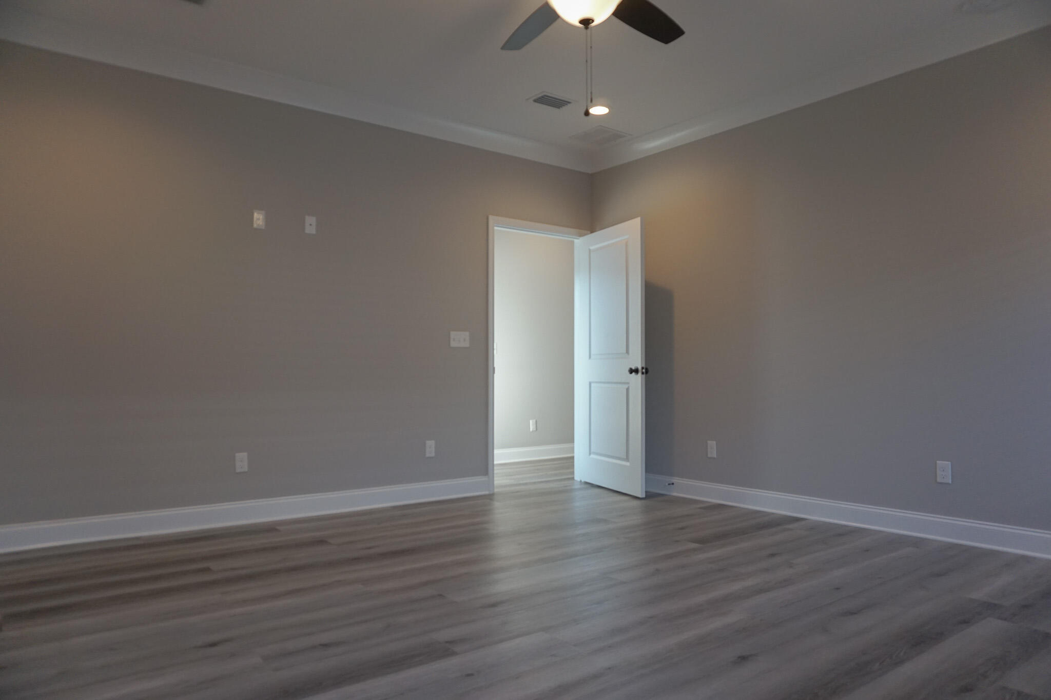 48 9th Avenue Shalimar, FL 32579 - Photo 24 of 60 a view of an empty room with wooden floor