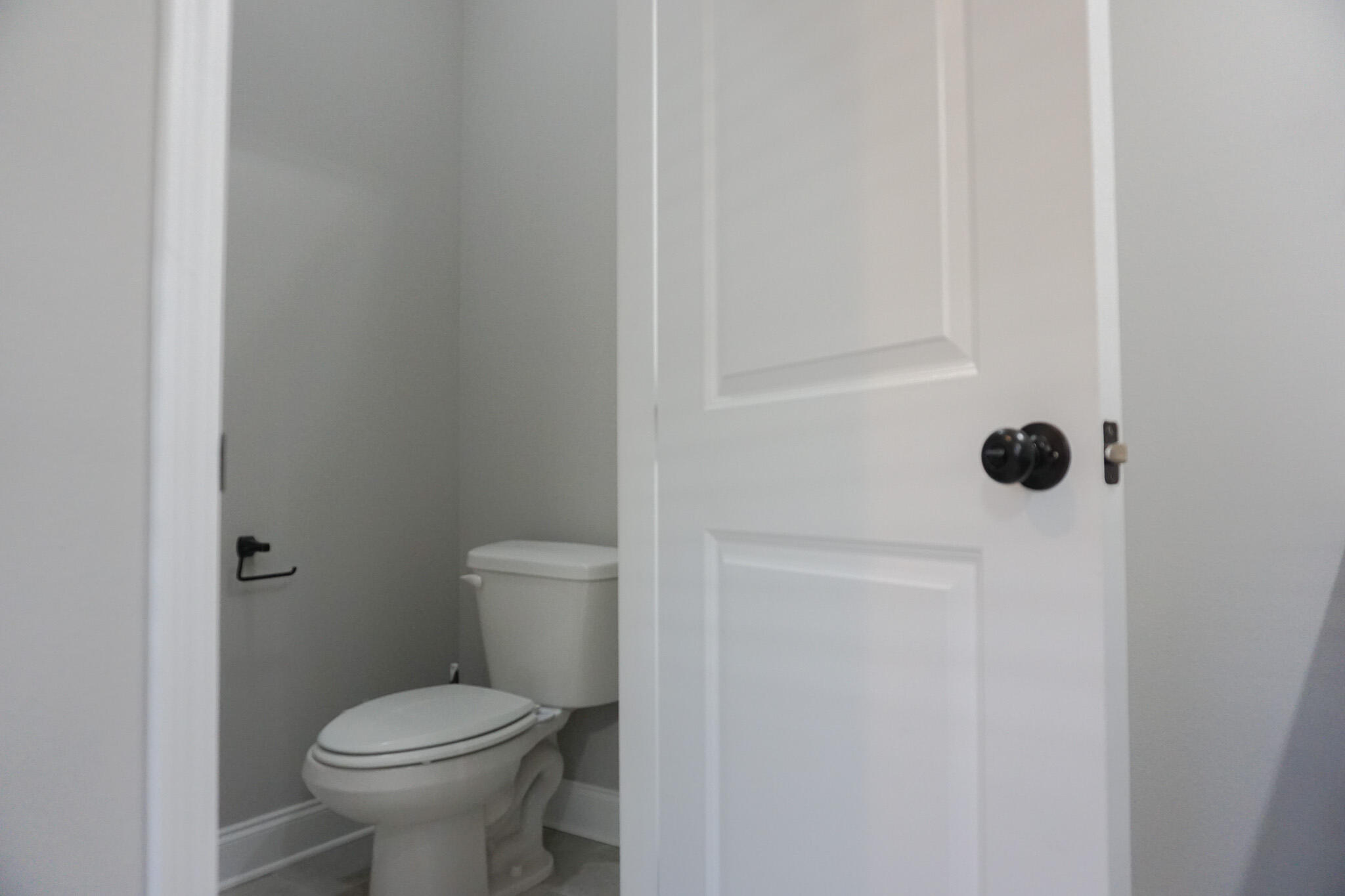 48 9th Avenue Shalimar, FL 32579 - Photo 34 of 60 a white toilet sitting next to a white sink