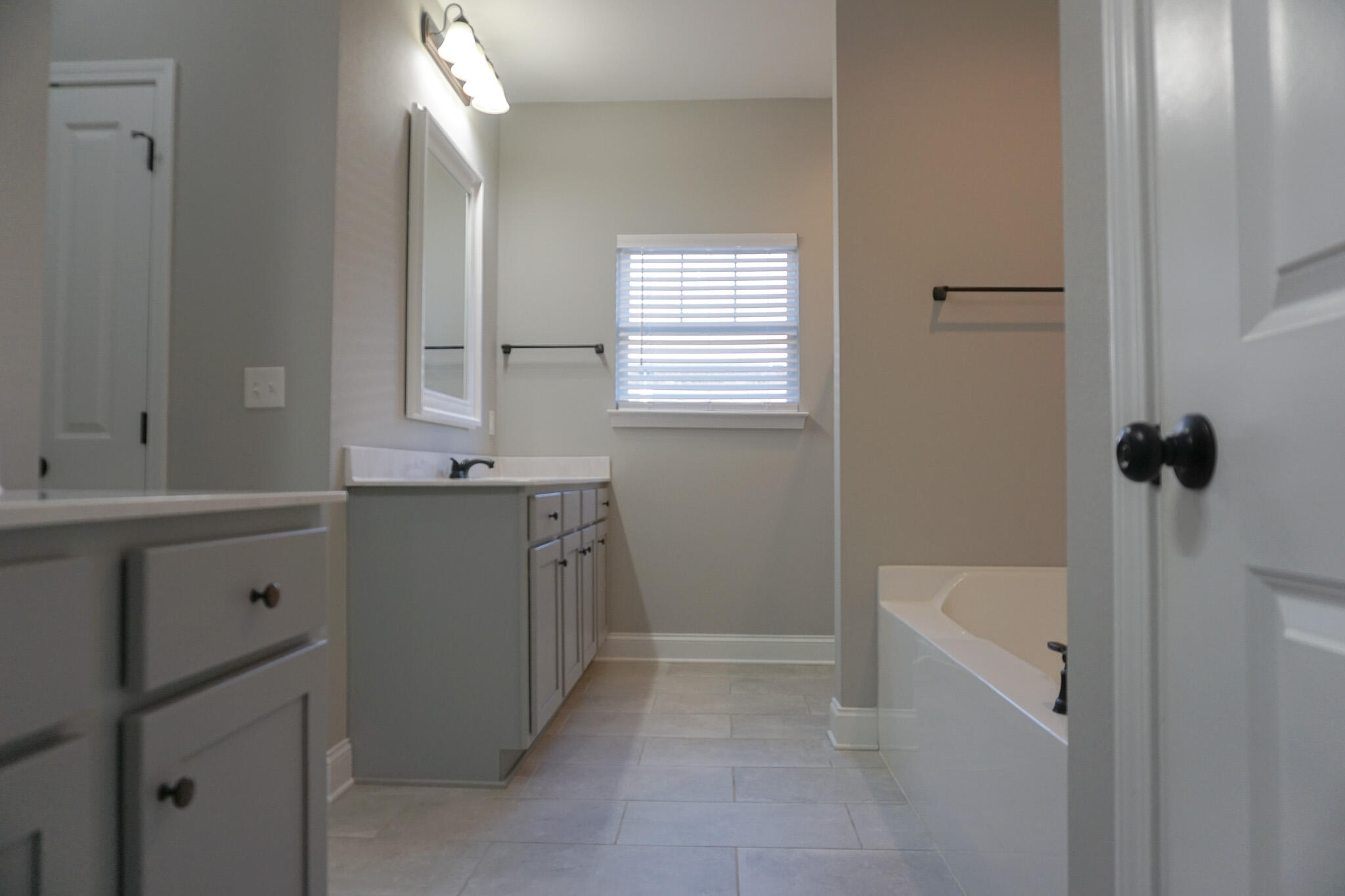 48 9th Avenue Shalimar, FL 32579 - Photo 35 of 60 a bathroom with a sink a vanity and mirror
