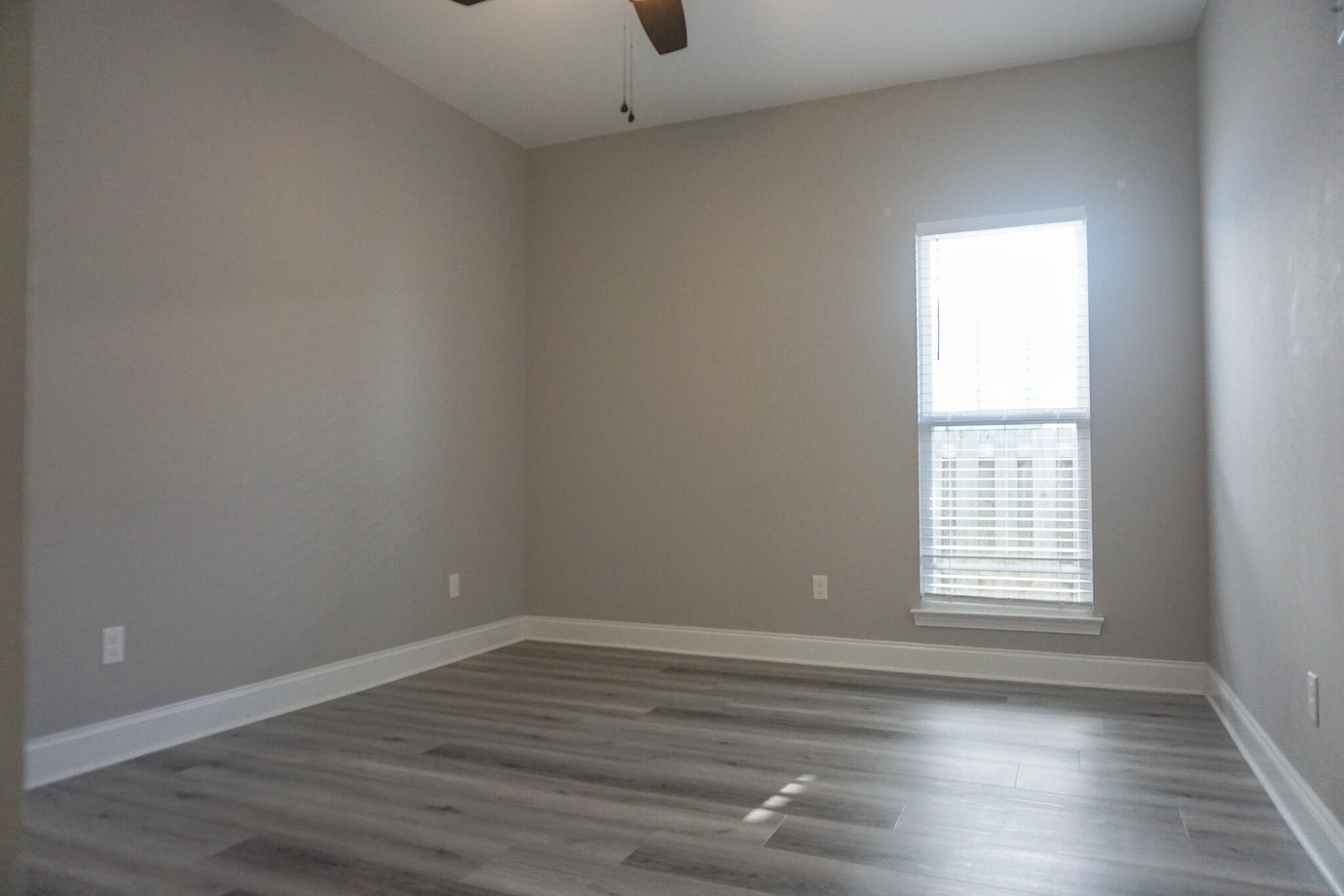 48 9th Avenue Shalimar, FL 32579 - Photo 40 of 60 a view of an empty room with wooden floor and a window