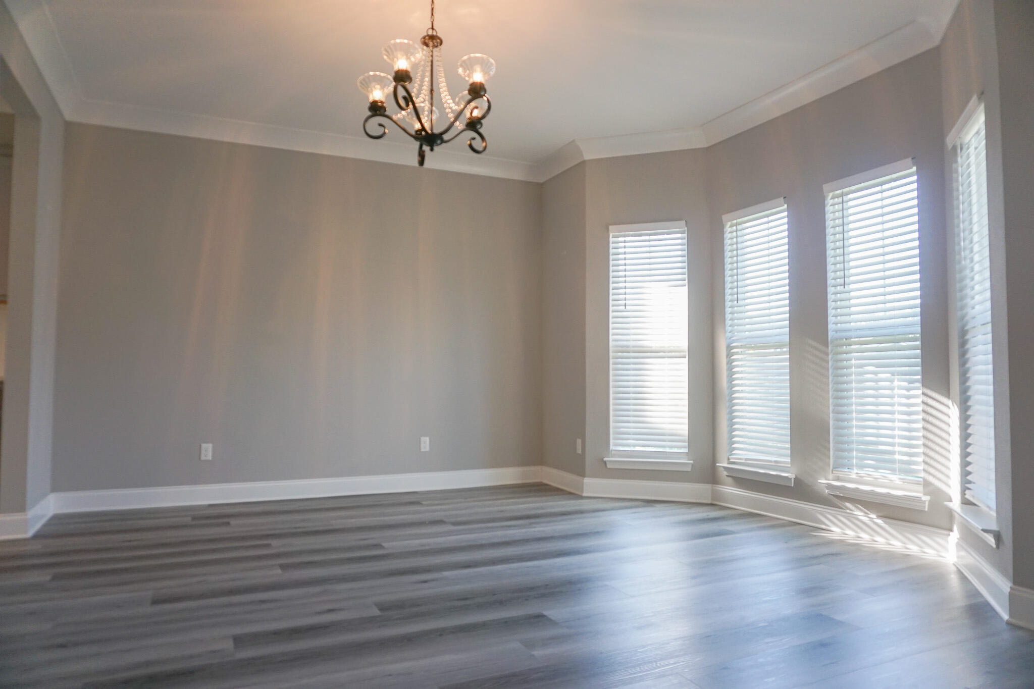 48 9th Avenue Shalimar, FL 32579 - Photo 4 of 60 a view of empty room with wooden floor and fan