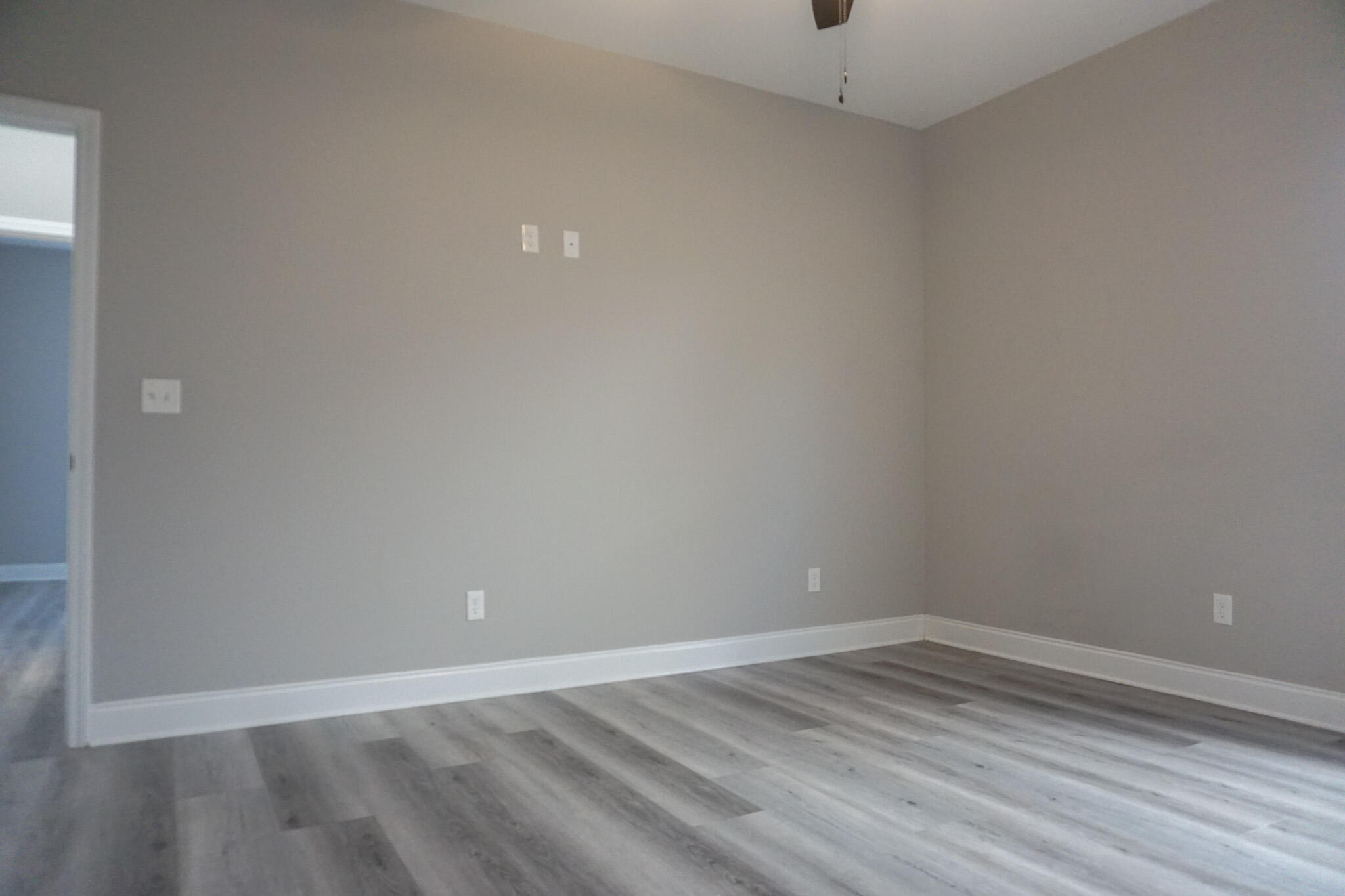 48 9th Avenue Shalimar, FL 32579 - Photo 42 of 60 a view of an empty room with wooden floor and a window