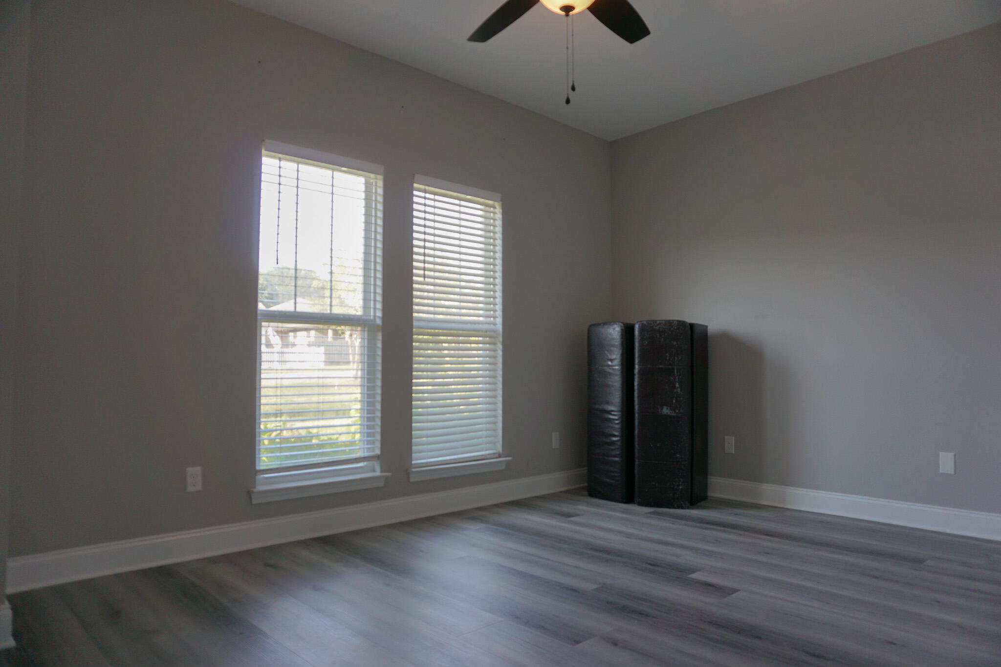 48 9th Avenue Shalimar, FL 32579 - Photo 45 of 60 an empty room with wooden floor and windows