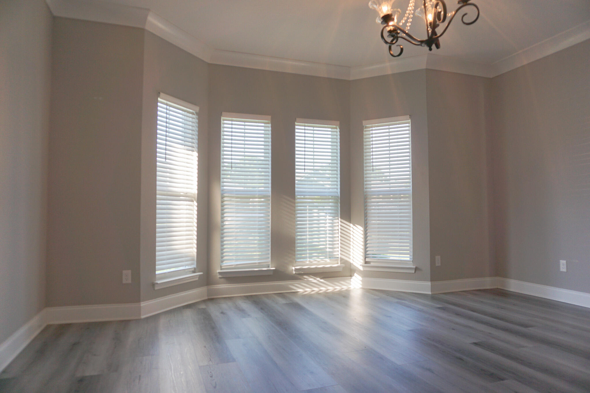 48 9th Avenue Shalimar, FL 32579 - Photo 5 of 60 an empty room with wooden floor and windows