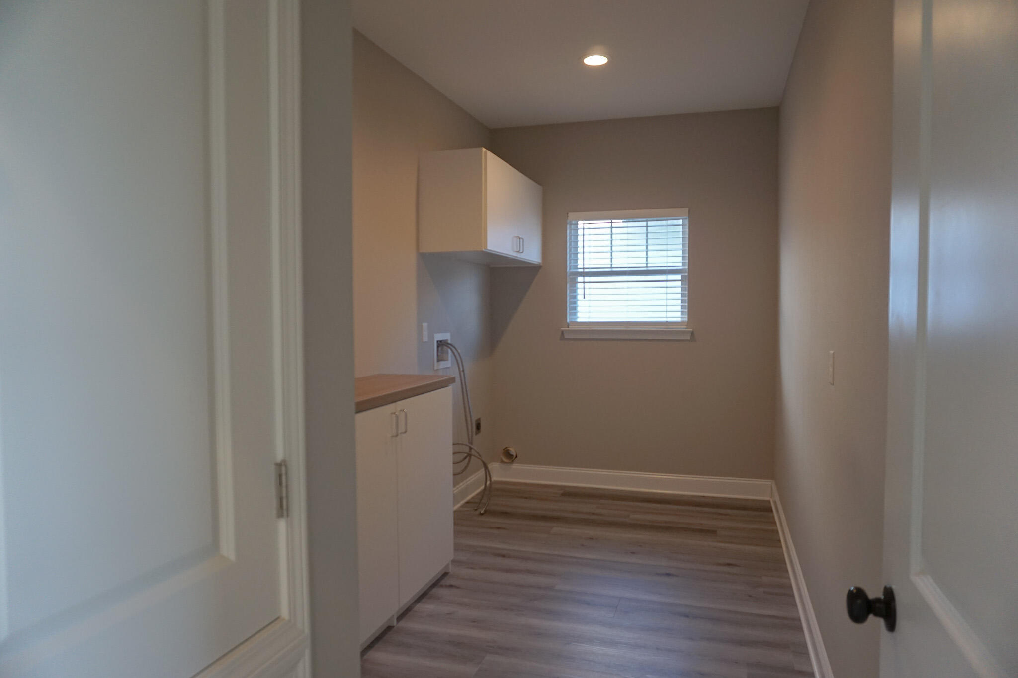 48 9th Avenue Shalimar, FL 32579 - Photo 51 of 60 a view of an empty room with wooden floor and a window