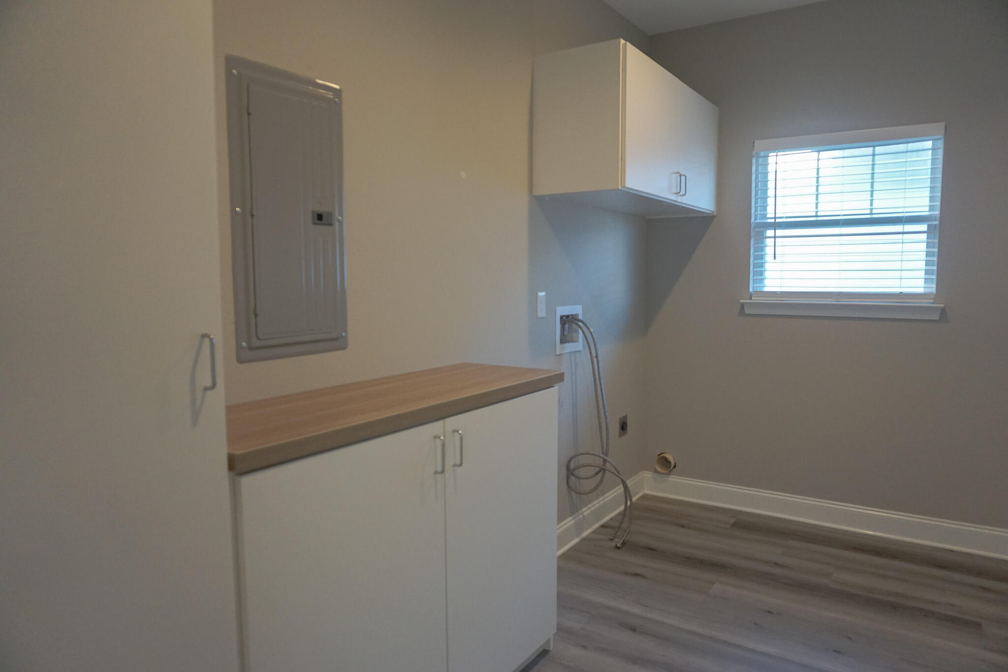 48 9th Avenue Shalimar, FL 32579 - Photo 52 of 60 a view of storage and utility room with wooden floor