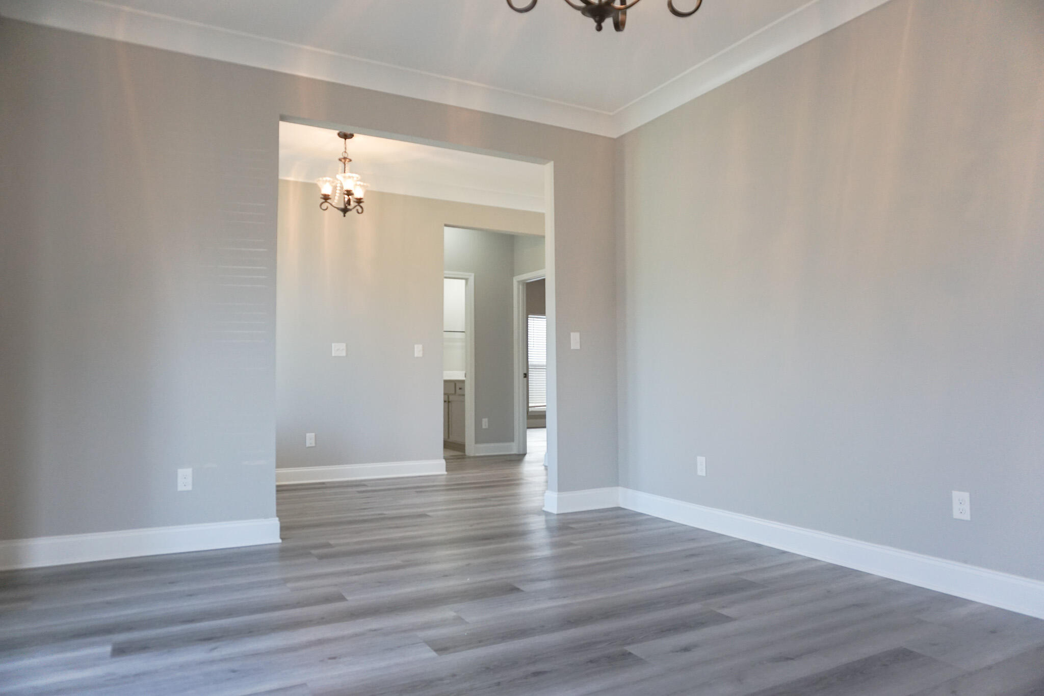 48 9th Avenue Shalimar, FL 32579 - Photo 6 of 60 a view of an empty room and wooden floor