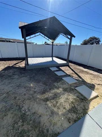 a view of a backyard of the house