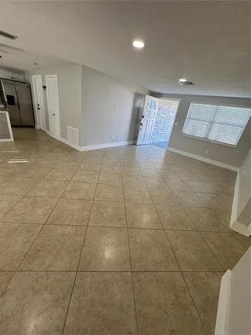 a view of a livingroom with furniture and window
