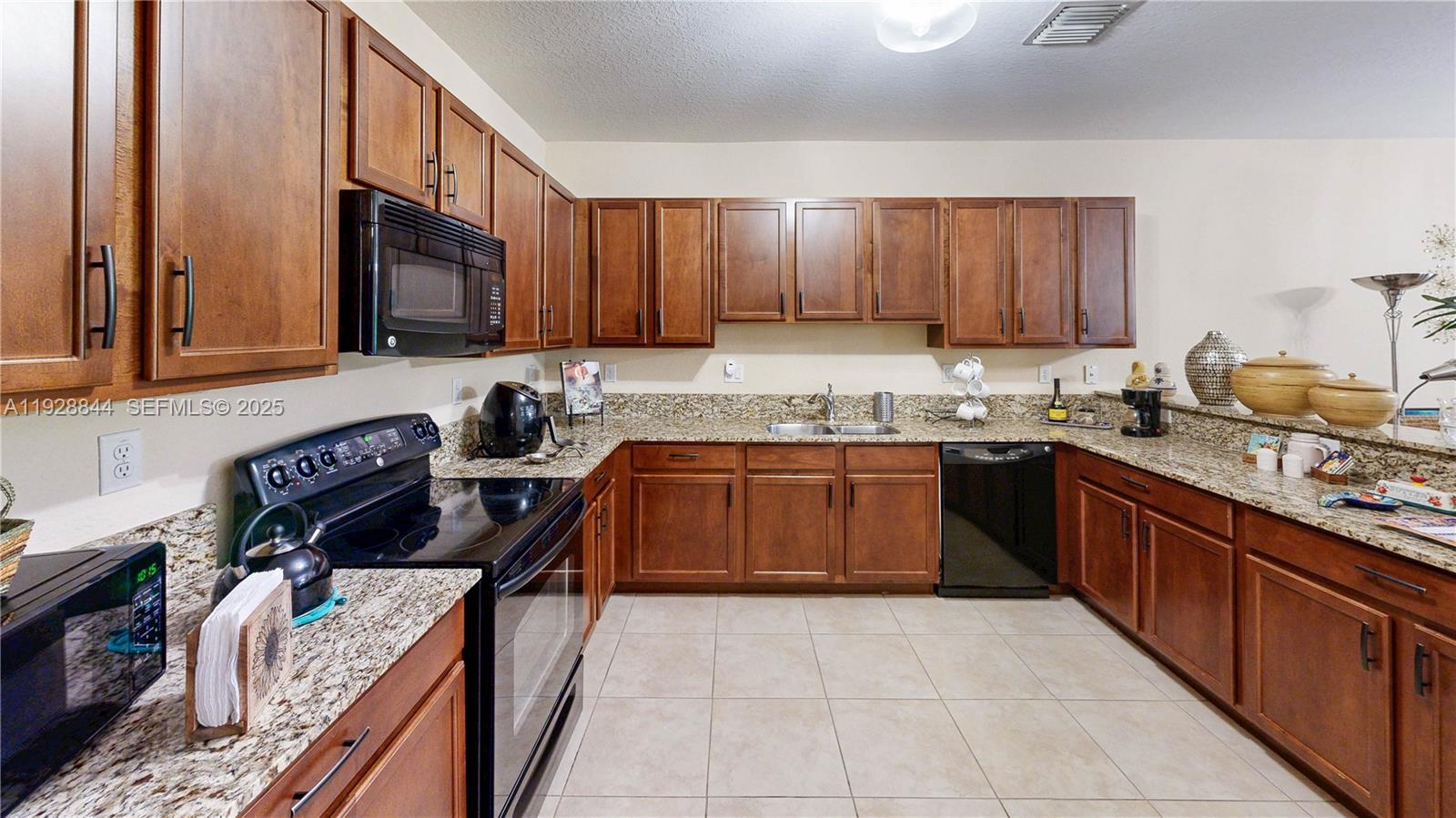 3090 Southeast 7th Court Homestead, FL 33033 - Photo 22 of 80 a kitchen with a sink stove top oven and cabinets