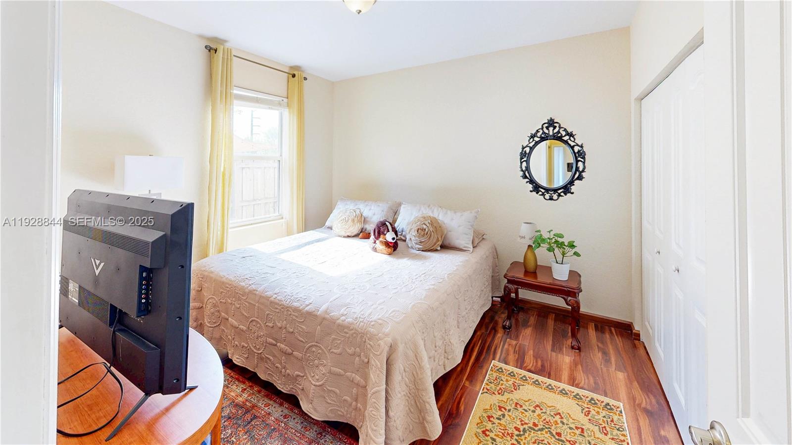 3090 Southeast 7th Court Homestead, FL 33033 - Photo 31 of 80 a bed sitting in a bedroom next to a window