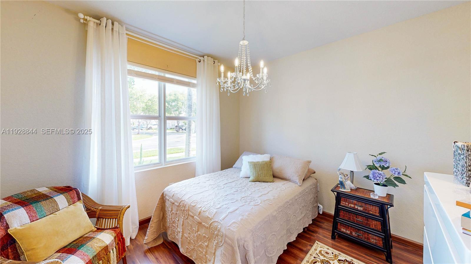 3090 Southeast 7th Court Homestead, FL 33033 - Photo 36 of 80 a bedroom with a bed and wooden floor