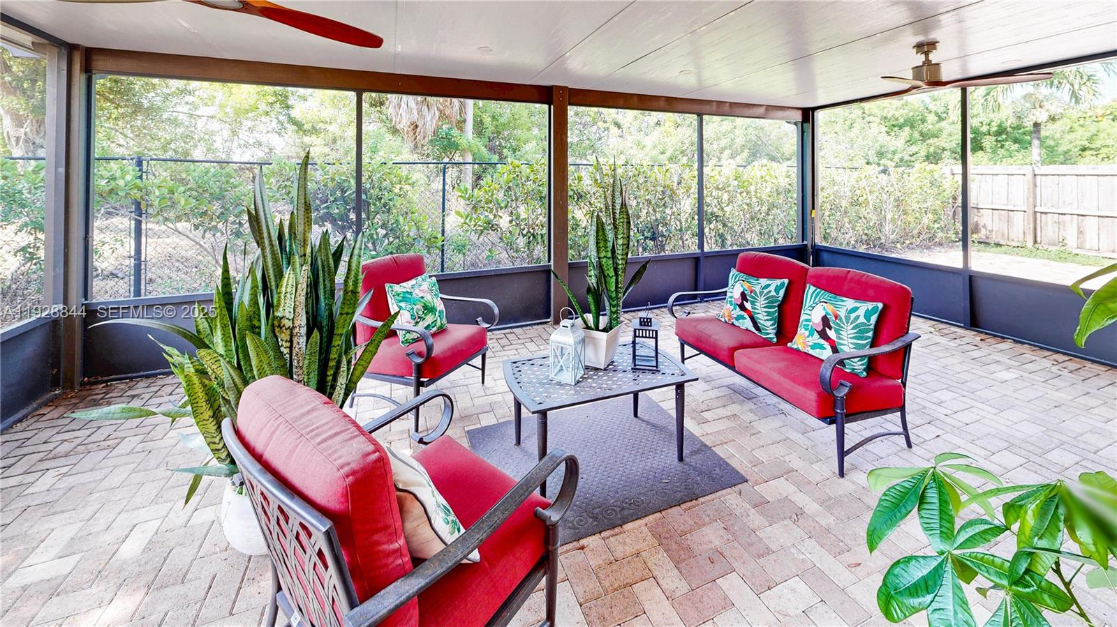 3090 Southeast 7th Court Homestead, FL 33033 - Photo 41 of 80 a living room filled with furniture and a large window
