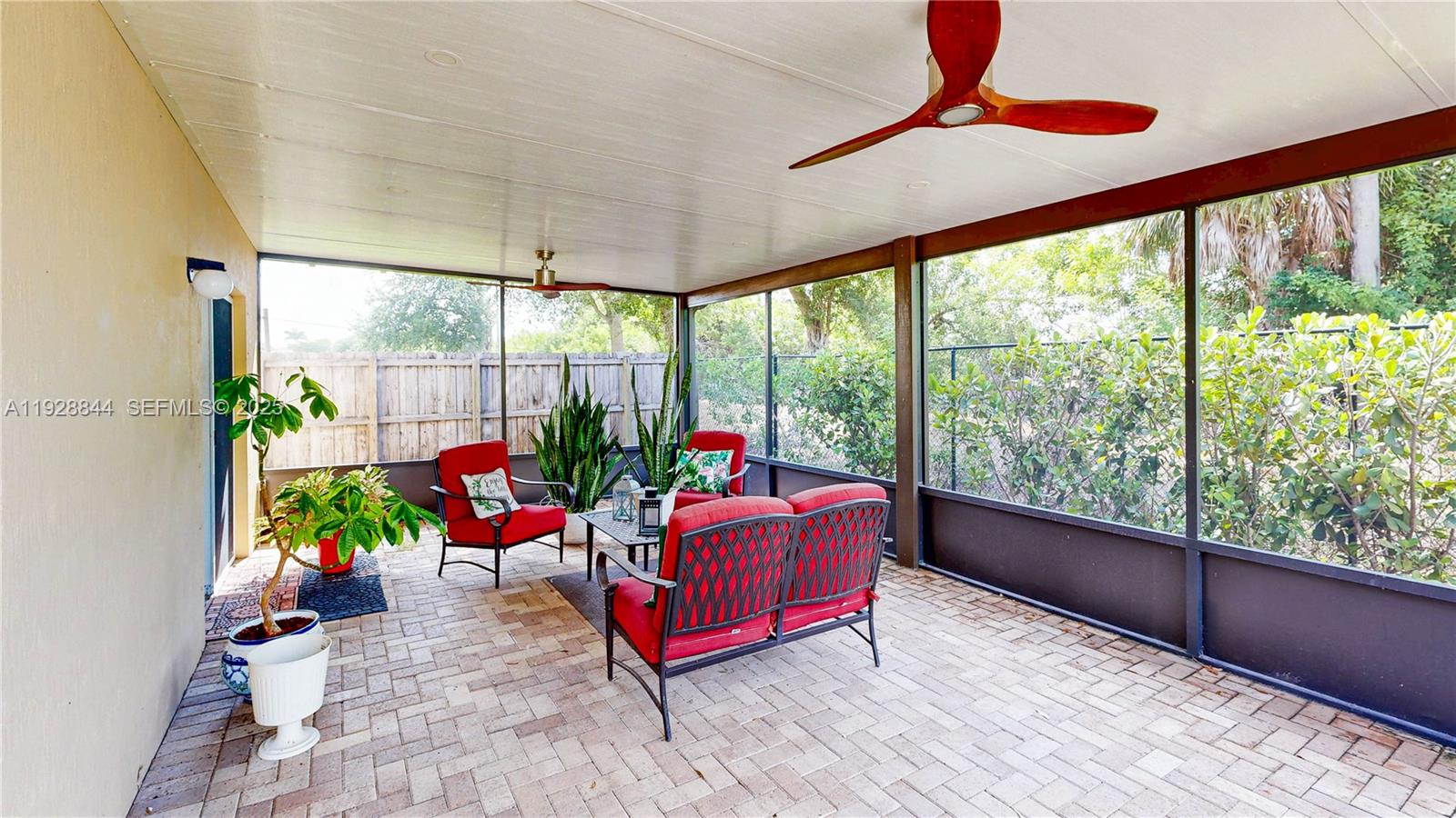 3090 Southeast 7th Court Homestead, FL 33033 - Photo 42 of 80 a living room filled with furniture and a potted plant