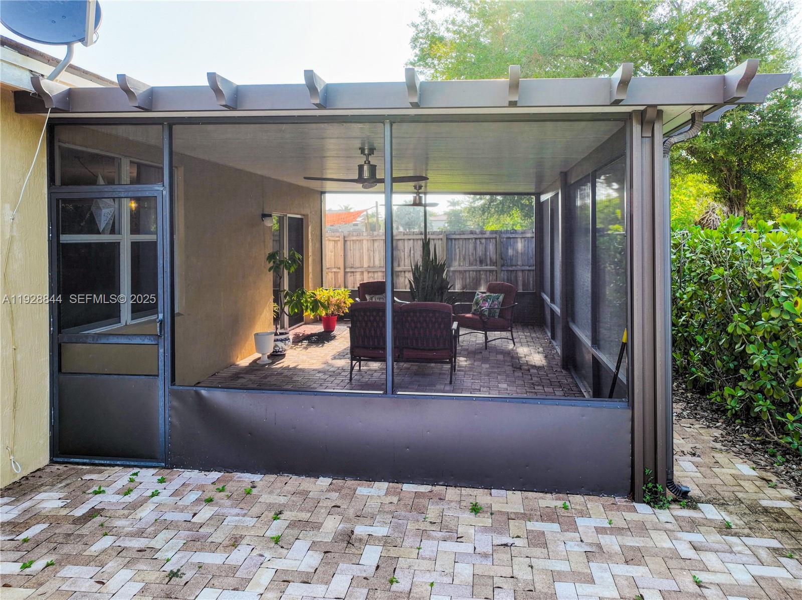 3090 Southeast 7th Court Homestead, FL 33033 - Photo 43 of 80 a view of a patio with table and chairs under an umbrella
