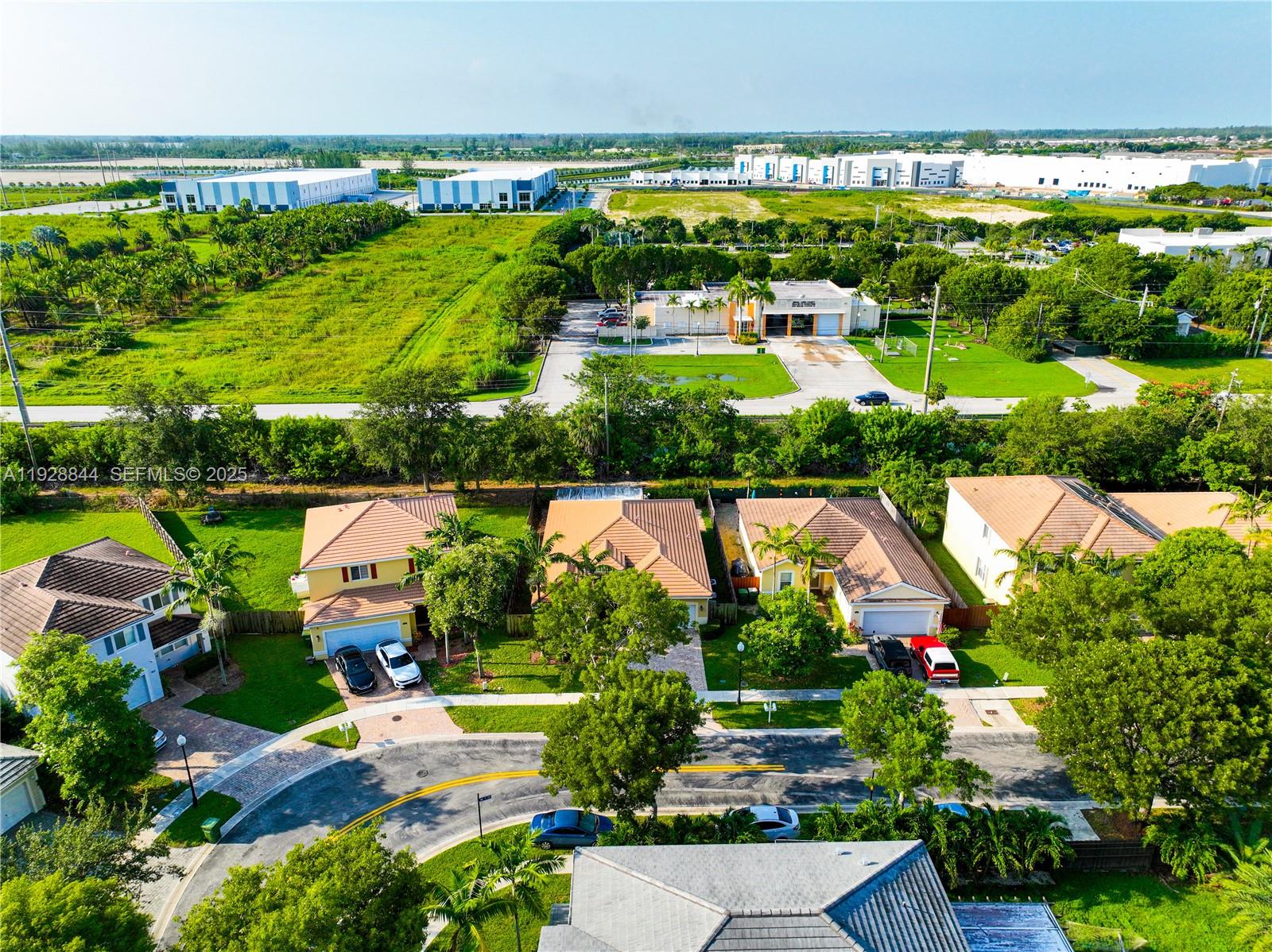 3090 Southeast 7th Court Homestead, FL 33033 - Photo 59 of 80 an aerial view of lake residential houses with outdoor space and swimming pool