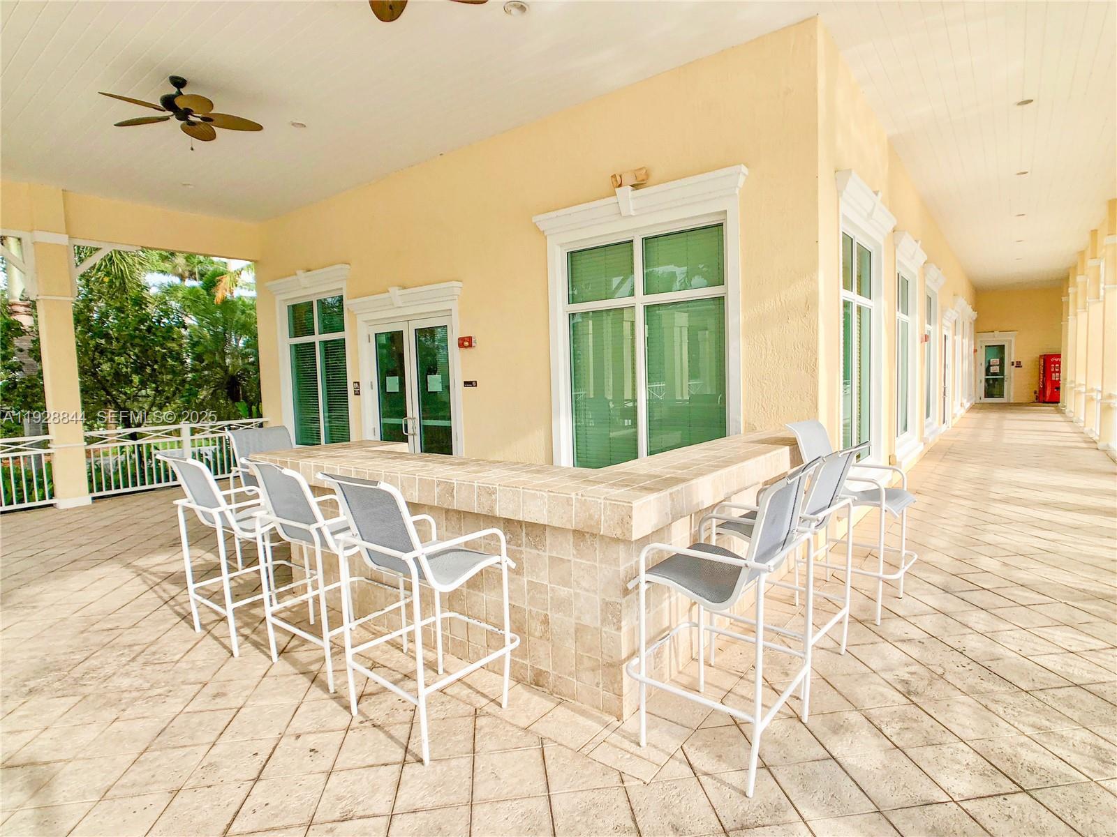 3090 Southeast 7th Court Homestead, FL 33033 - Photo 78 of 80 a view of a dining room with furniture and a backyard