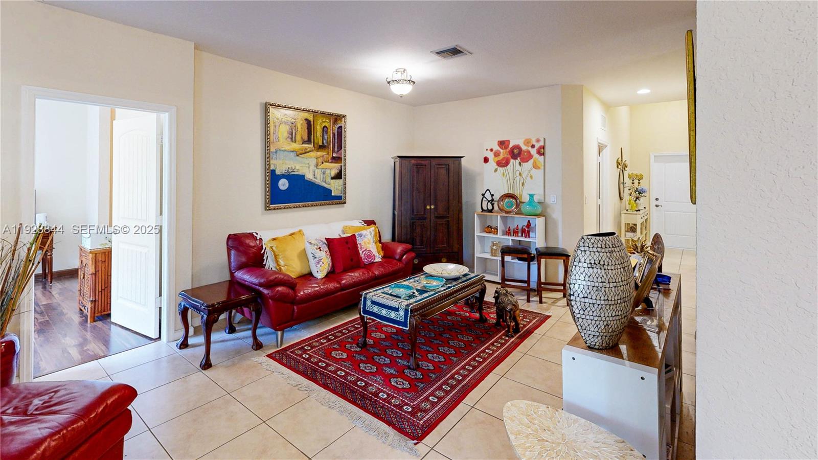 3090 Southeast 7th Court Homestead, FL 33033 - Photo 8 of 80 a living room with furniture and a rug
