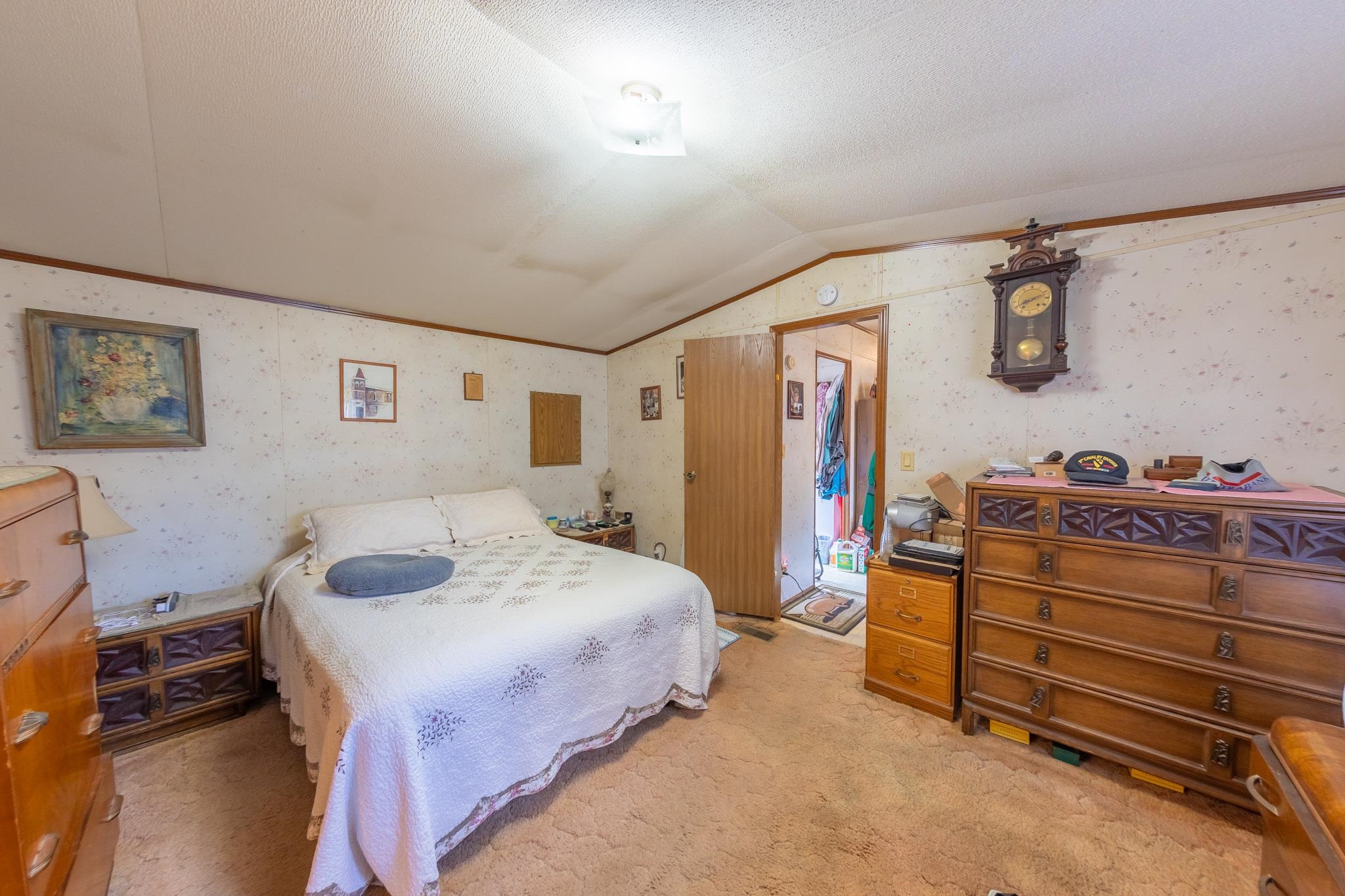 219 Honeysuckle Circle Fruita, CO 81521 - Photo 14 of 16 a bedroom with a bed and a dresser