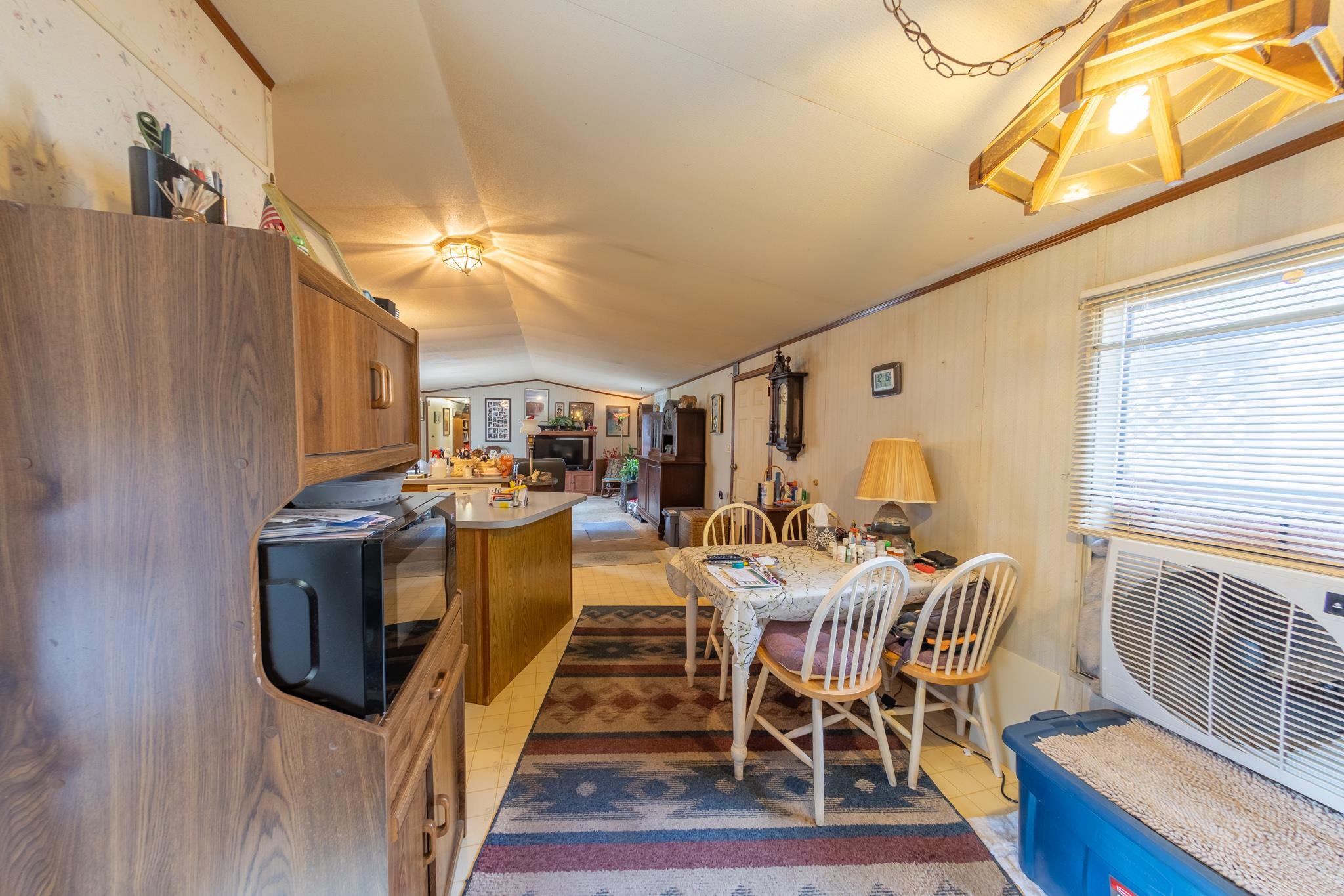 219 Honeysuckle Circle Fruita, CO 81521 - Photo 16 of 16 a dining room with furniture and wooden floor