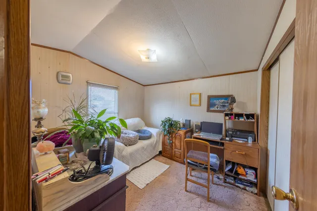 a living room with furniture and flowers
