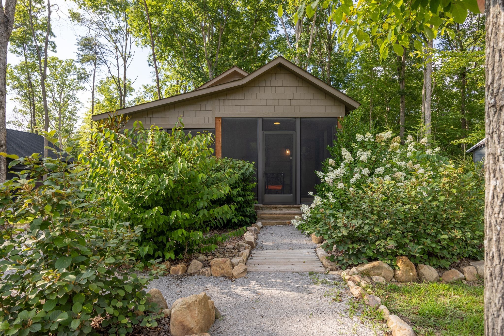 292 Waters Edge Way Tracy City, TN 37387 - Photo 12 of 17 a front view of a house with garden
