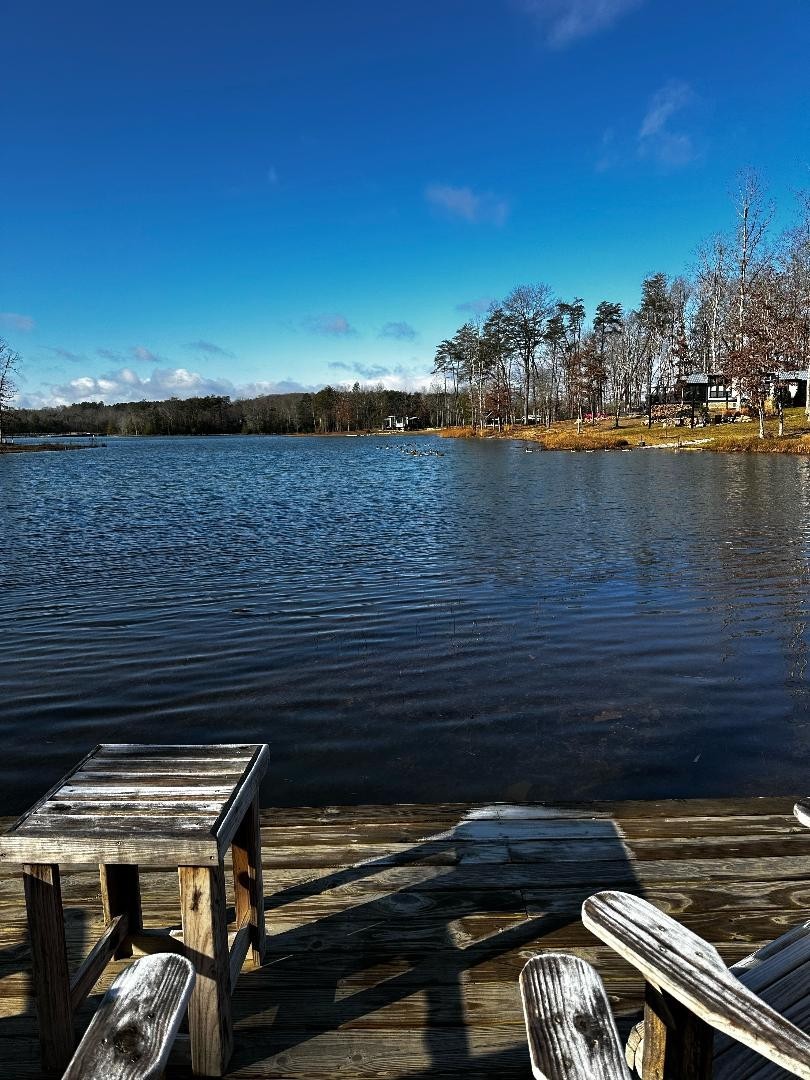 292 Waters Edge Way Tracy City, TN 37387 - Photo 16 of 17 a roof deck view with a table and chairs