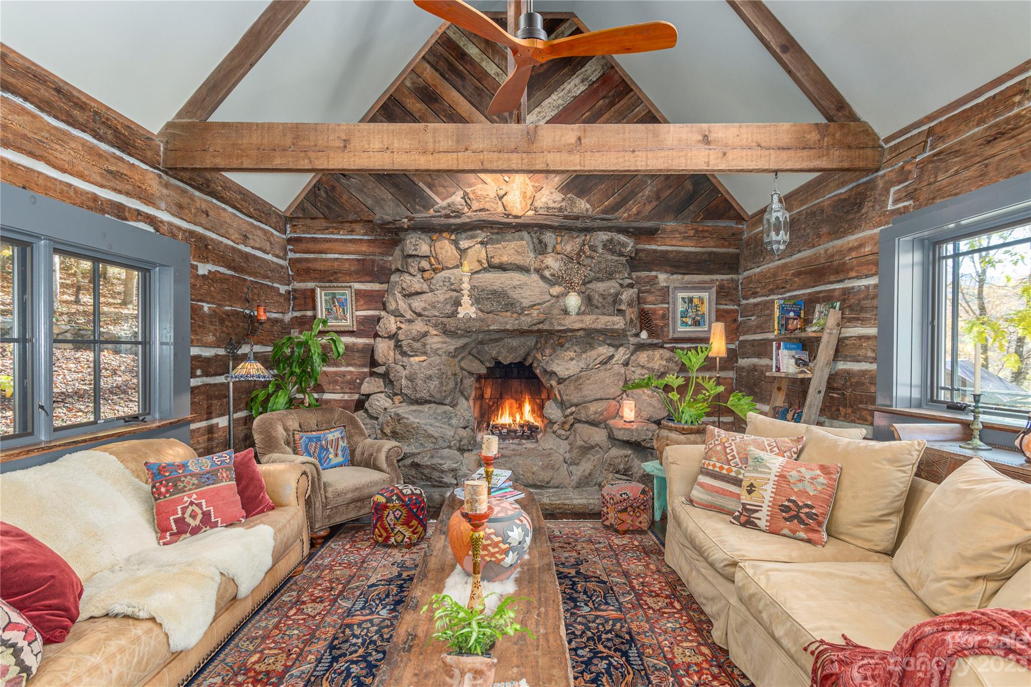 a living room with lots of furniture and a chandelier