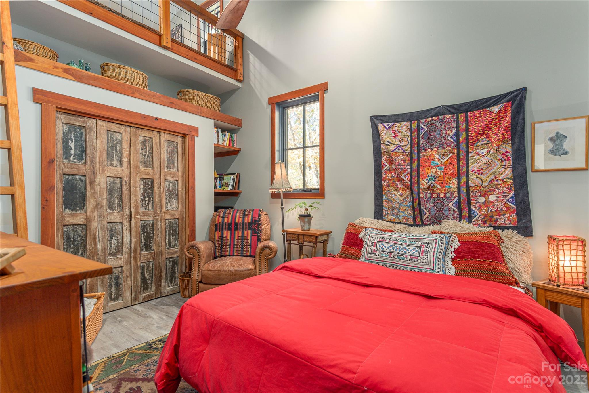 33 Taproot Trail Barnardsville, NC 28709 - Photo 20 of 46 a bedroom with a large bed and large windows