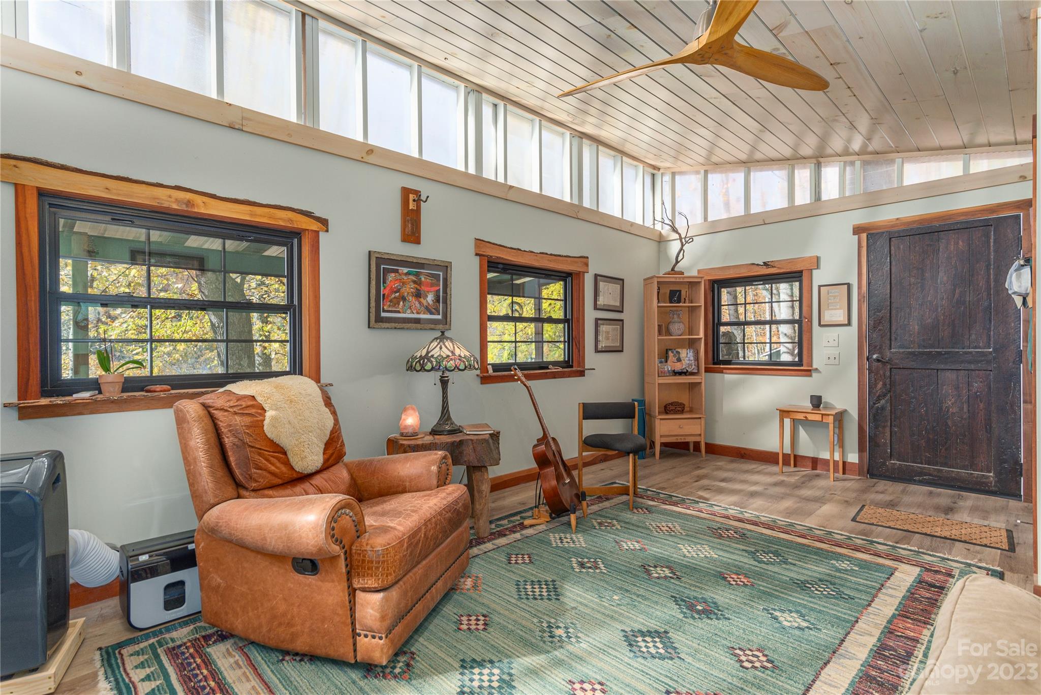 33 Taproot Trail Barnardsville, NC 28709 - Photo 33 of 46 a living room with furniture wooden floor and a table