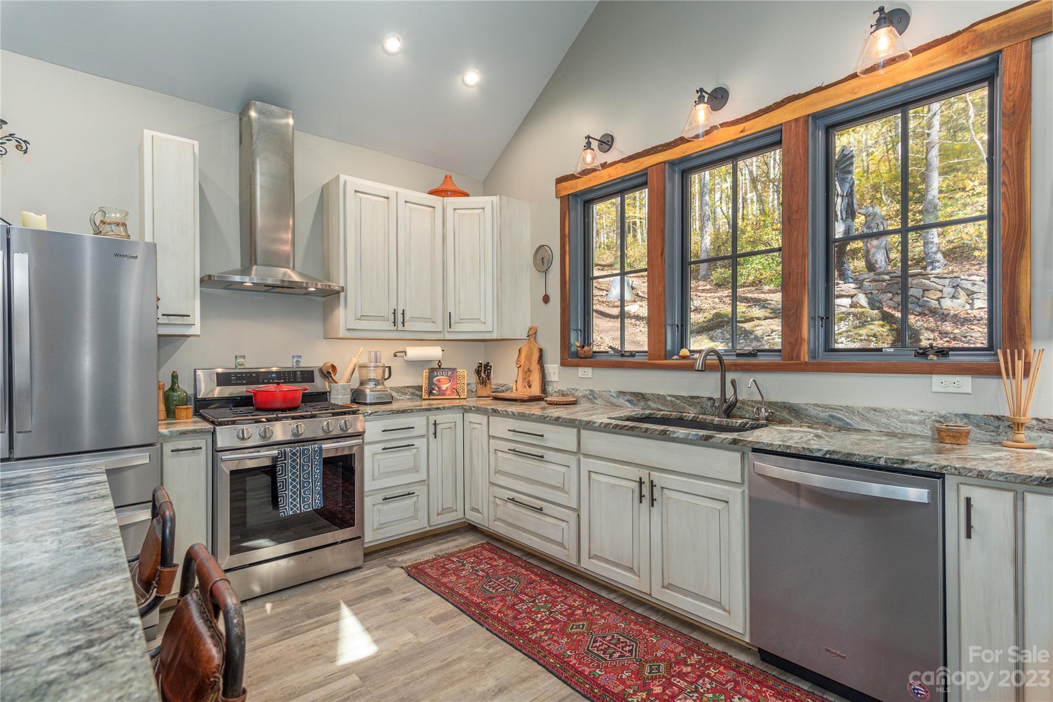 33 Taproot Trail Barnardsville, NC 28709 - Photo 7 of 46 a kitchen with stainless steel appliances granite countertop a stove a sink and a refrigerator