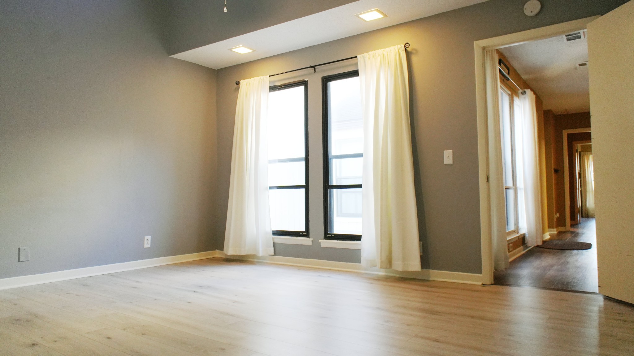220 Harpers Mill Road Hermitage, TN 37076 - Photo 18 of 46 an empty room with wooden floor and windows
