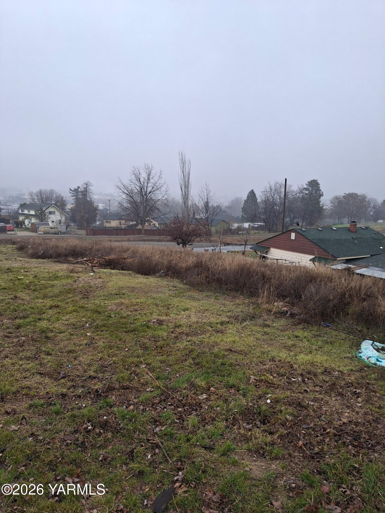 a view of a lake with houses in the back