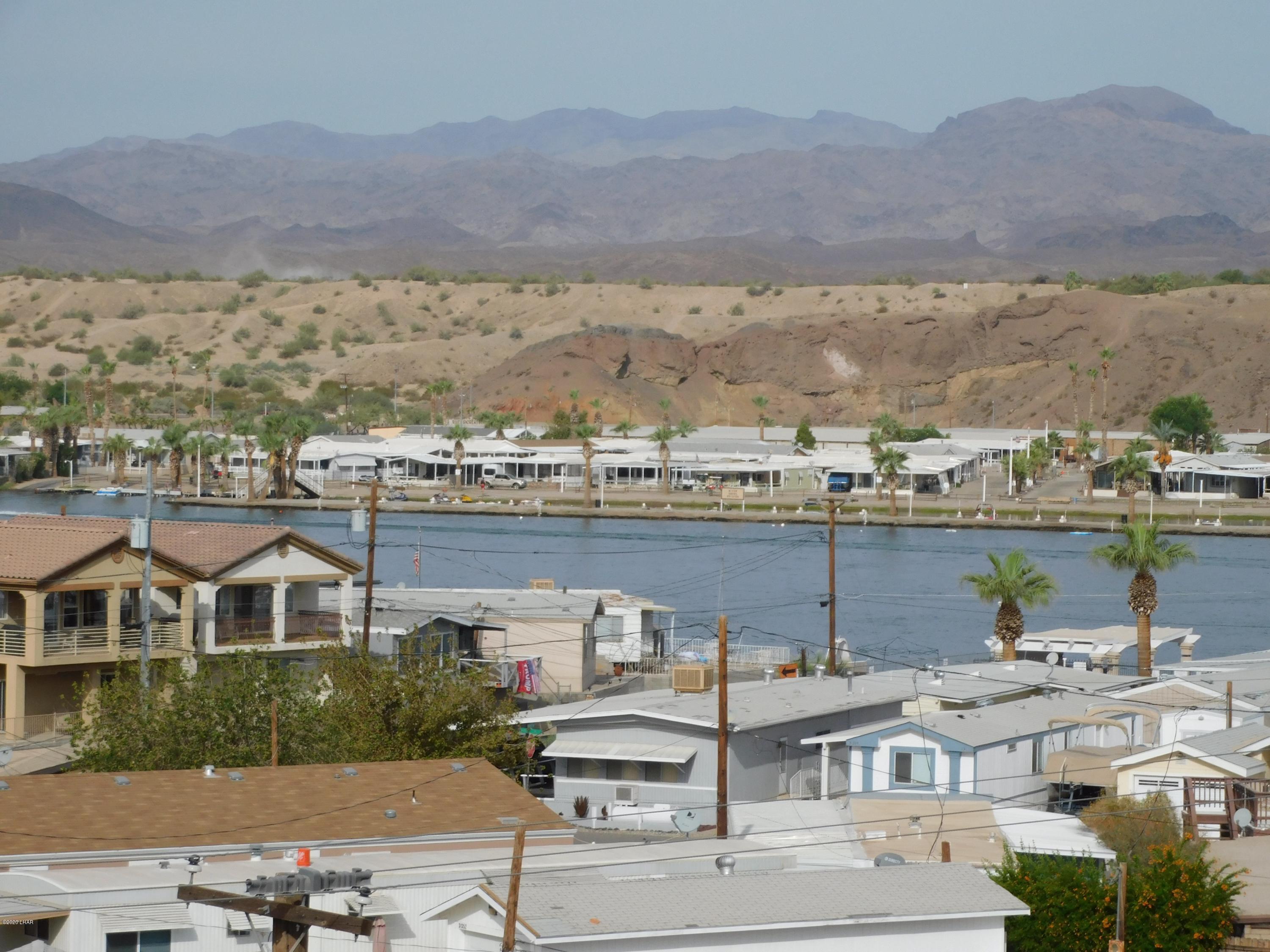 10176 Harbor View Road Parker, AZ 85344 - Photo 1 of 14 an aerial view of a house with a lake view