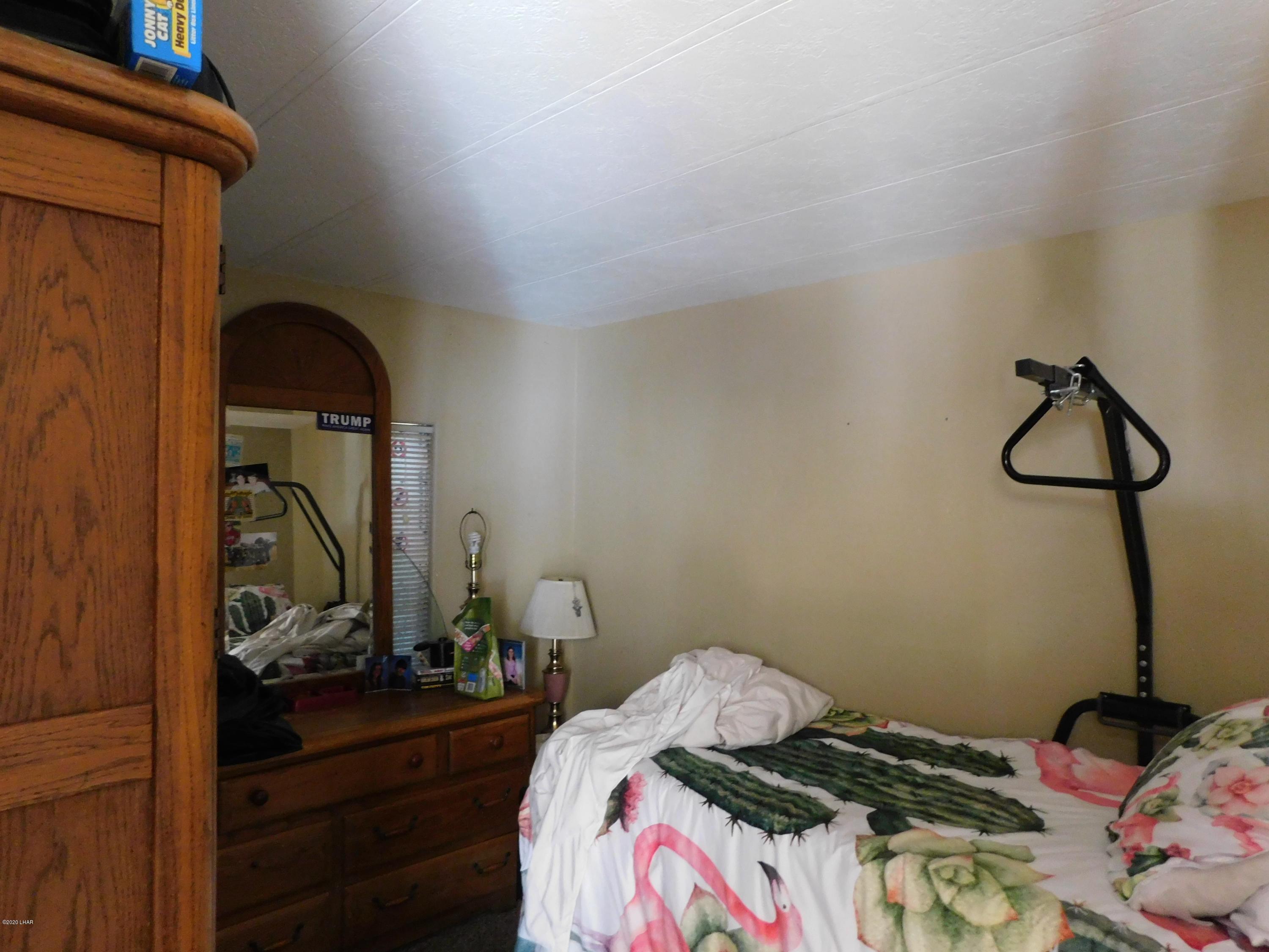 10176 Harbor View Road Parker, AZ 85344 - Photo 12 of 14 a bedroom with a bed and a dresser