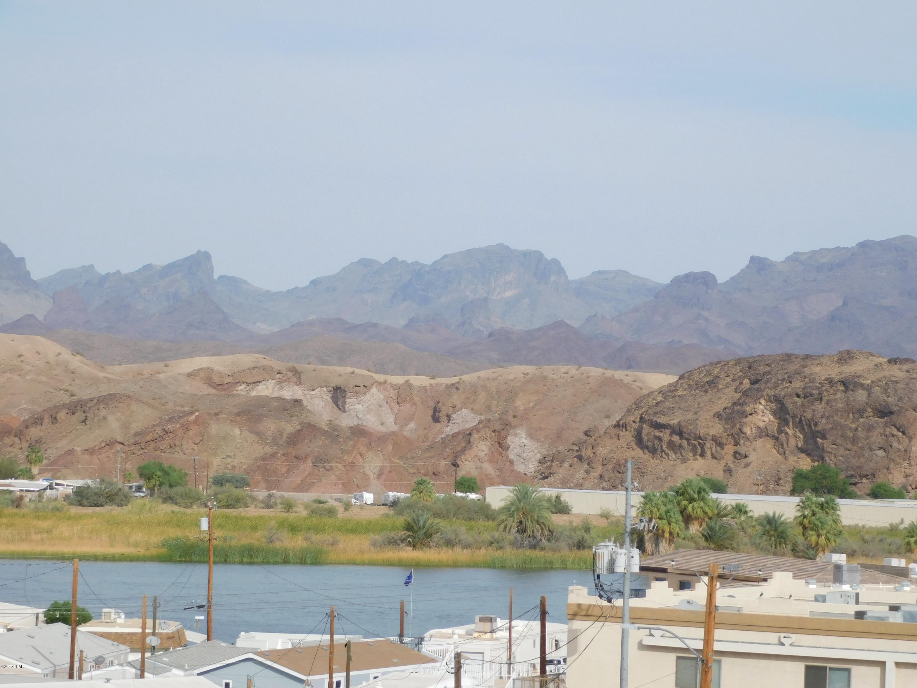 10176 Harbor View Road Parker, AZ 85344 - Photo 2 of 14 a view of lake with mountain