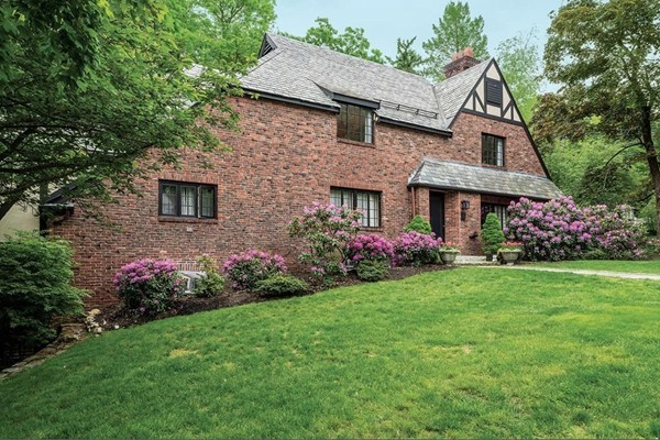 a front view of a house with garden