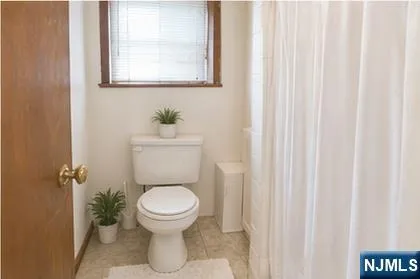 a bathroom with a toilet and a sink