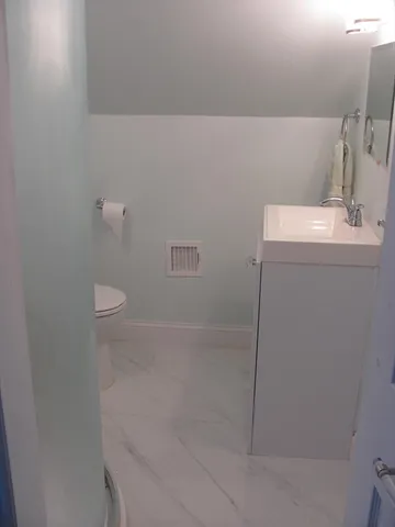 a view of wooden floor in an empty room