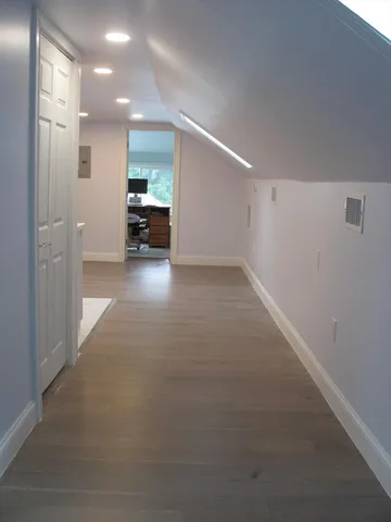 a bathroom with a sink a toilet and mirror