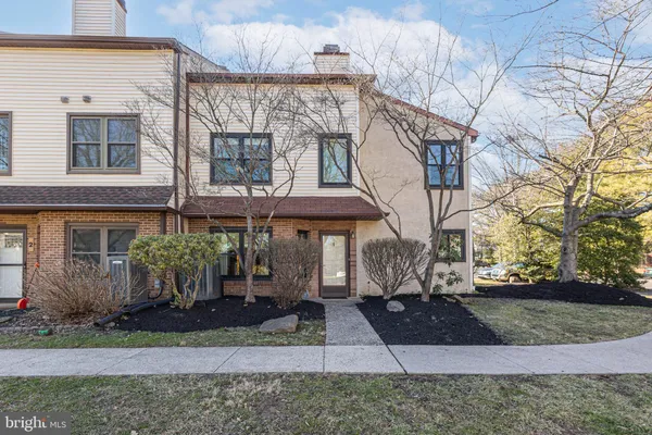a view of a brick building with many windows