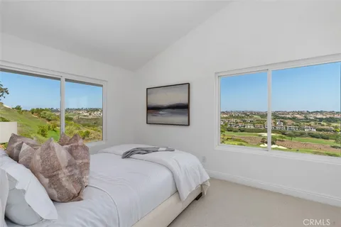 an aerial view of a house with a lake view