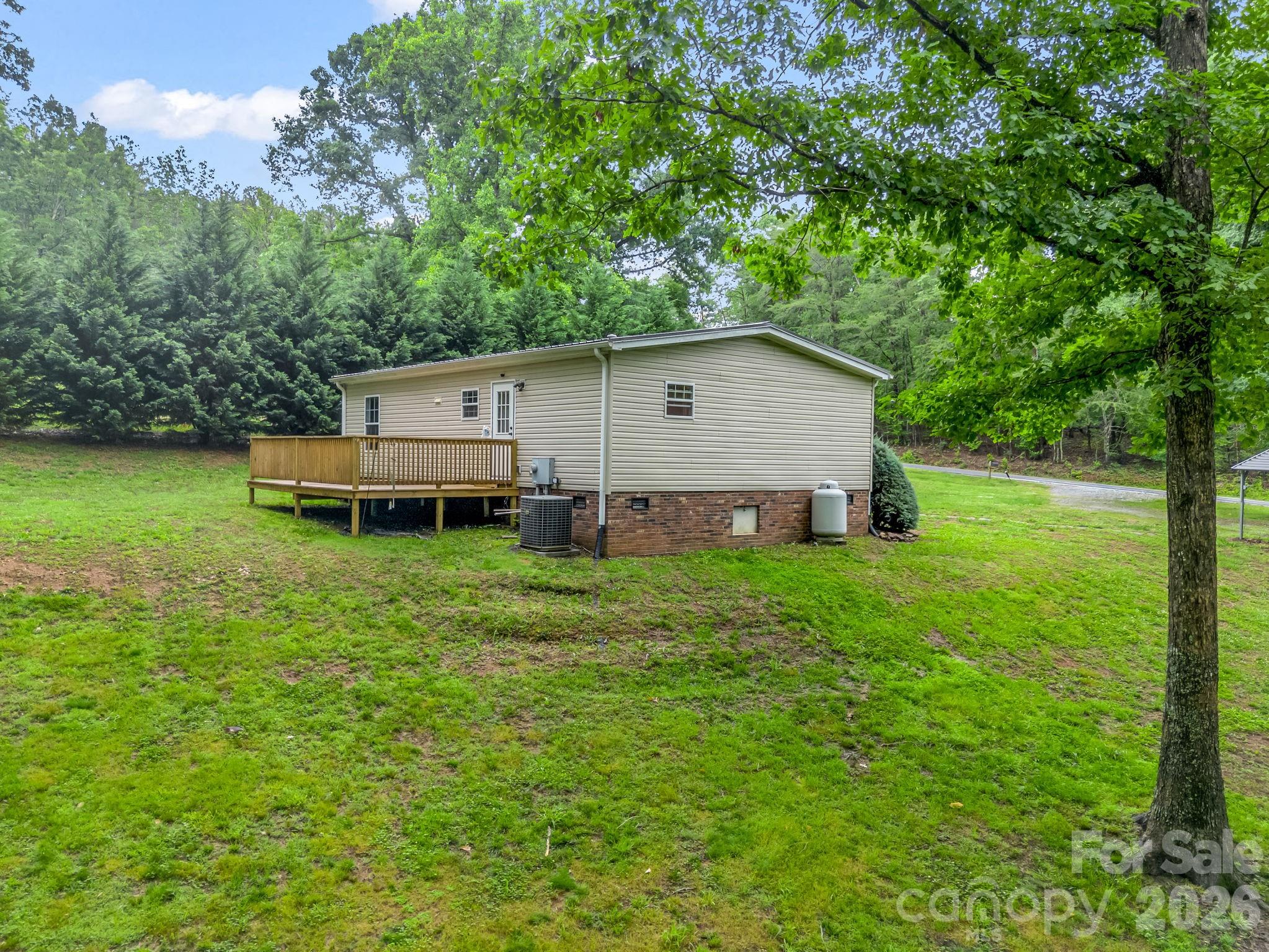 1449 Toney Road Bostic, NC 28018 - Photo 9 of 43 a backyard of a house with table and chairs
