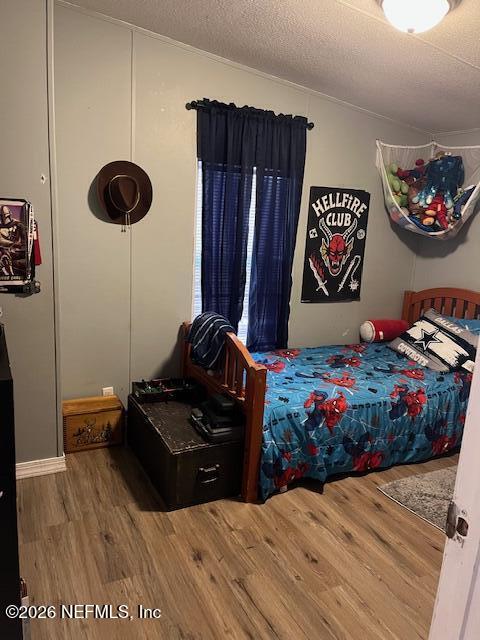 104 Lunker Lodge Road Georgetown, FL 32139 - Photo 11 of 19 a bedroom with bed and a painting on the wall