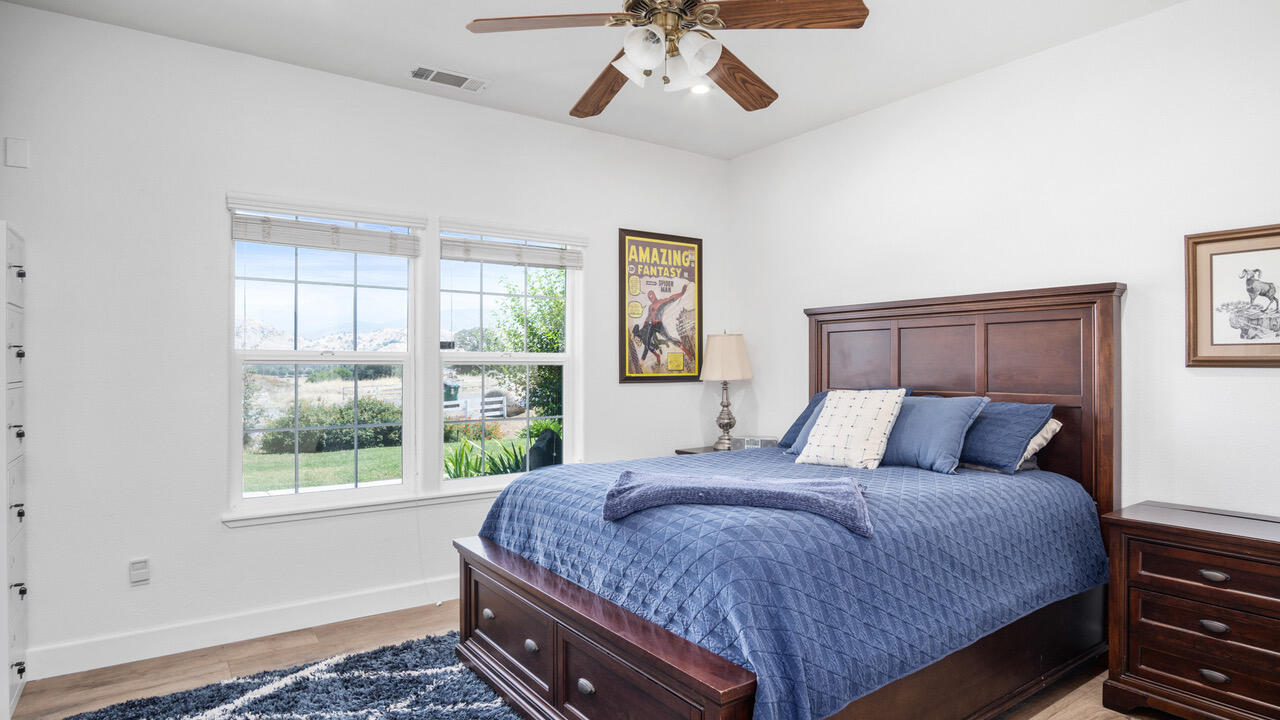 16657 Thomas Drive Springville, CA 93265 - Photo 23 of 37 a bedroom with a large bed and a window
